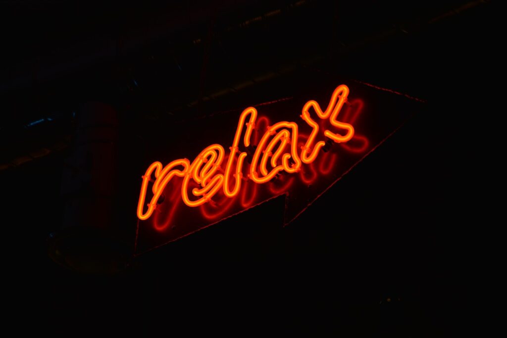 Neon sign that says “relax”