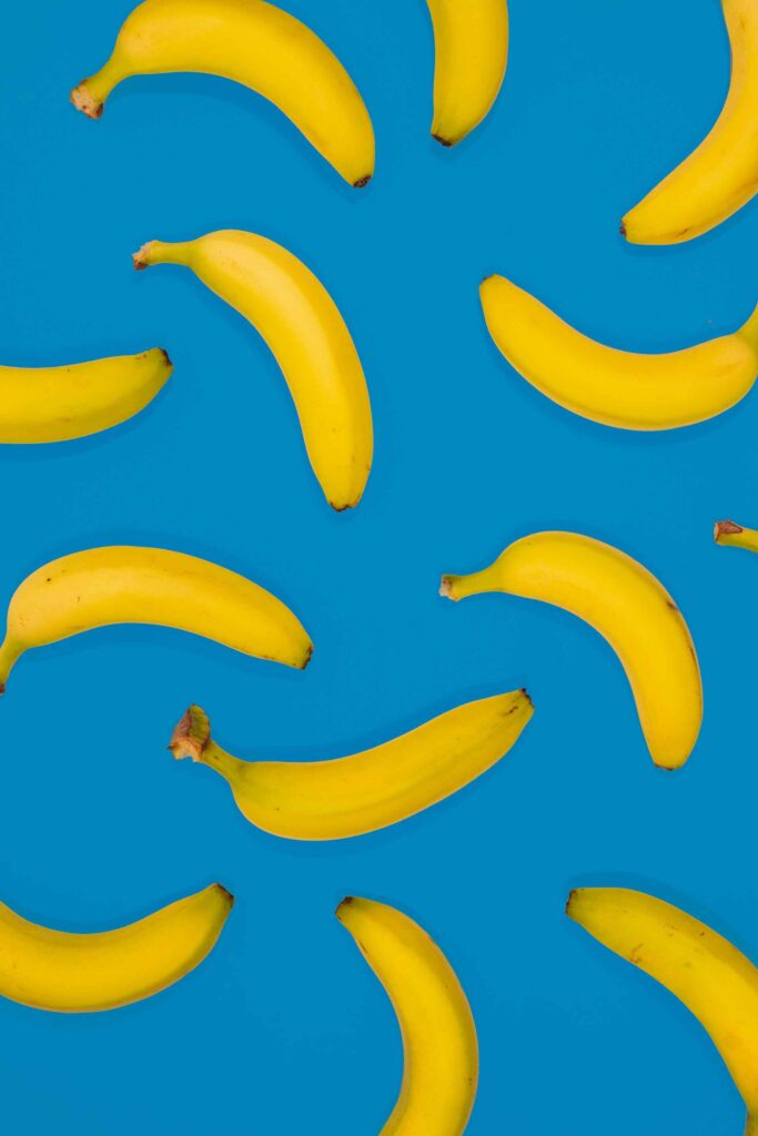 Yellow bananas against blue background