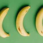 three-bananas-green-background