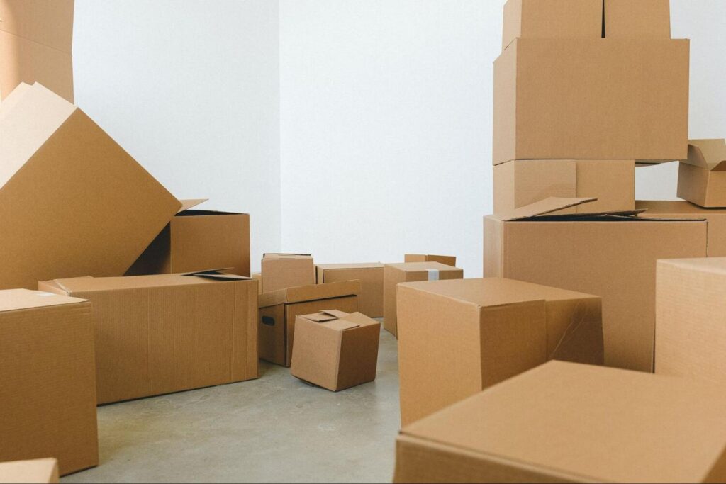Anonymous cardboard boxes in an empty room.